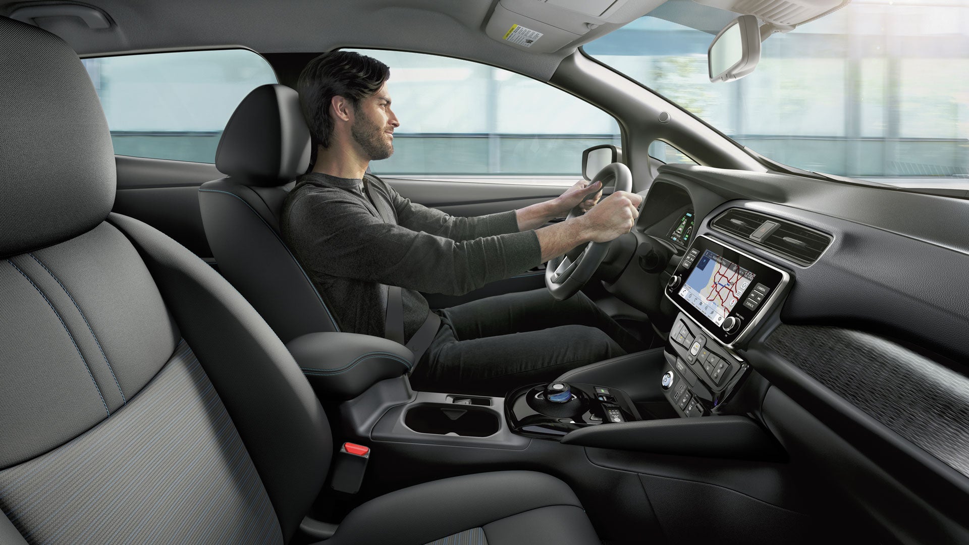 2025 Nissan Leaf interior side shot with man driving